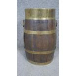 A Victorian brass banded coopered oak barrel with twin handles. H.33 D19CM