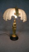 A gilt bronze 19th century table lamp of a female figure with a frosted glass shell shade. H.54 W.