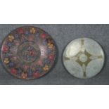 An Dutch Indonesian engraved bronze plate with engraved stylised floral design and central medallion