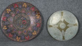 An Dutch Indonesian engraved bronze plate with engraved stylised floral design and central medallion