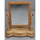 A Victorian walnut swing frame toilet mirror. H.57cm