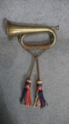 A military brass bugle with silk brocade tassles. L.30cm