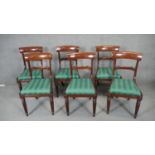 A set of six William IV mahogany dining chairs with acanthus carved backs and drop in seats on
