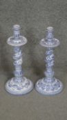 A pair of Casa Pupo Portuguese blue and white hand painted ceramic candle sticks with foliate and