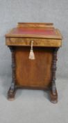 A Victorian burr walnut and satinwood inlaid Davenport with inset leather writing slope above four