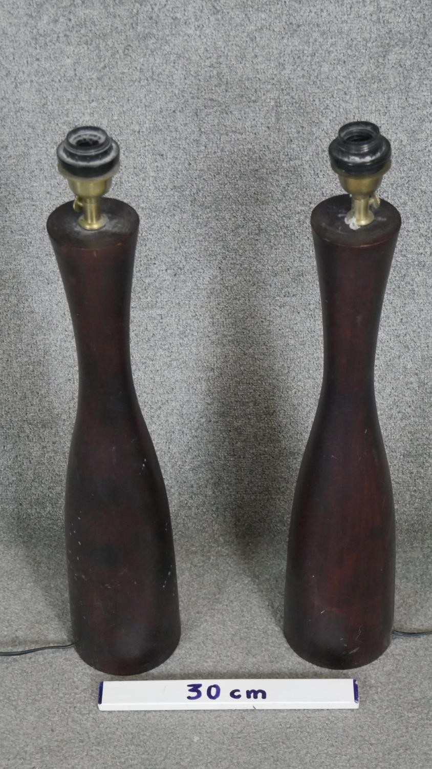 A pair of carved stained table lamps of cylindrical design. H.70CM - Image 2 of 3