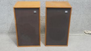 A pair of teak Wharfdale speakers with cables. H.48 W.26 D.24