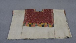 A Tibetan woven woo tunic with colourful geometric design. L.80 W.101