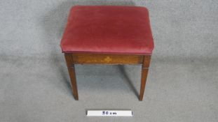 A C.1900 rosewood piano stool with satinwood inlay and hinged compartment containing sheet music. 55