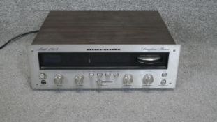 A teak and chrome Marantz stereo reciever model 2015 with cable. H.13 W.35