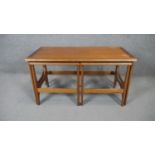 A nest of three 1970's vintage teak occasional tables. H.52 W.100 D.50cm