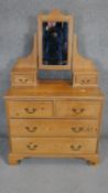 A Victorian style dressing chest with swing mirror on shaped bracket feet. H.150 W.90 D.48cm