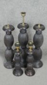 Four carved and stained table lamps with ridged bulbous design. H.53CM