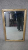 A gilt framed wall mirror. H.122 W.46cm
