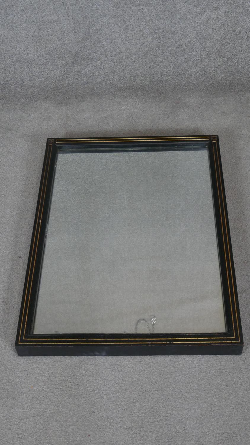 A 19th century ebonised and gilt framed wall mirror. h77 w57