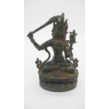 A gilt bronze antique Tibetan Buddha Manjushree with Sword or Wisdom. H.25cm