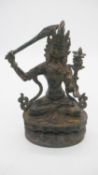A gilt bronze antique Tibetan Buddha Manjushree with Sword or Wisdom. H.25cm
