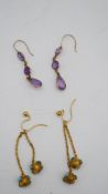 Two pairs of antique earrings. One pair of 9 carat rose gold and amethyst drop earrings and a pair