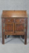 A mid century oak antique style fall front bureau with fitted interior. h93 w68 d40