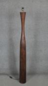 A large stained and tapering wooden standard lamp. H158