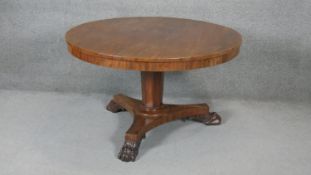 A 19th century mahogany tilt top dining table on inverted facetted base. h70 d122
