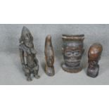 Four carved hardwood tribal figures. Three African busts and one fertility statue. H.47CM