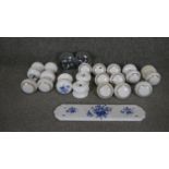 A collection of vintage and antique ceramic doorknobs and door plates. Some decorated with a blue