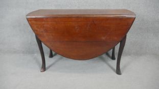 A mid Georgian mahogany drop flap dining table on carved cabriole supports. h75 w123 d54/182