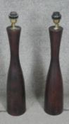 A pair of carved stained table lamps of cylindrical design. H.70CM