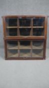 A vintage oak filing cabinet section with twin glazed lift up doors enclosing sliding pigeon hole