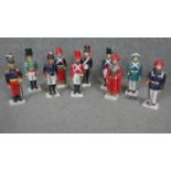 A collection of ten hand painted ceramic figures, each wearing a different Argentinian regimental