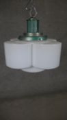 A vintage four petalled milk glass ceiling lamp with chrome fittings. H.40 W.30cm
