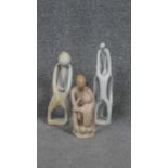 Three carved soapstone abstract figural statues. H. 30 W. 7