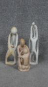 Three carved soapstone abstract figural statues. H. 30 W. 7