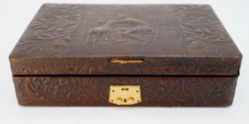 A collection of antique and costume jewellery in a brown embossed leather jewellery box and