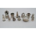 A collection of silver. Including two miniature silver burners, three pairs of silver salt and