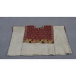 A Tibetan woven woo tunic with colourful geometric design. L.80 W.101