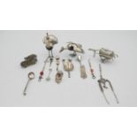 A collection of silver and white metal items. Including two Indian white metal peacock figures, a