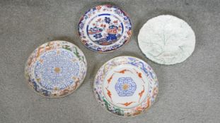 A collection of four ceramic and porcelain plates. Including two 18th century hand painted Chinese