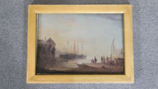A framed 19th century oil on canvas of a fishing village. Unsigned. H.29 x W.38cm