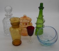 A collection of coloured glass. Including an Art Deco amber glass decanter and stopper, a