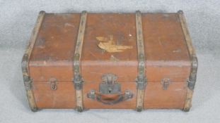 A vintage metal and oak bound travelling trunk. H.34 x W.78 x D.50cm