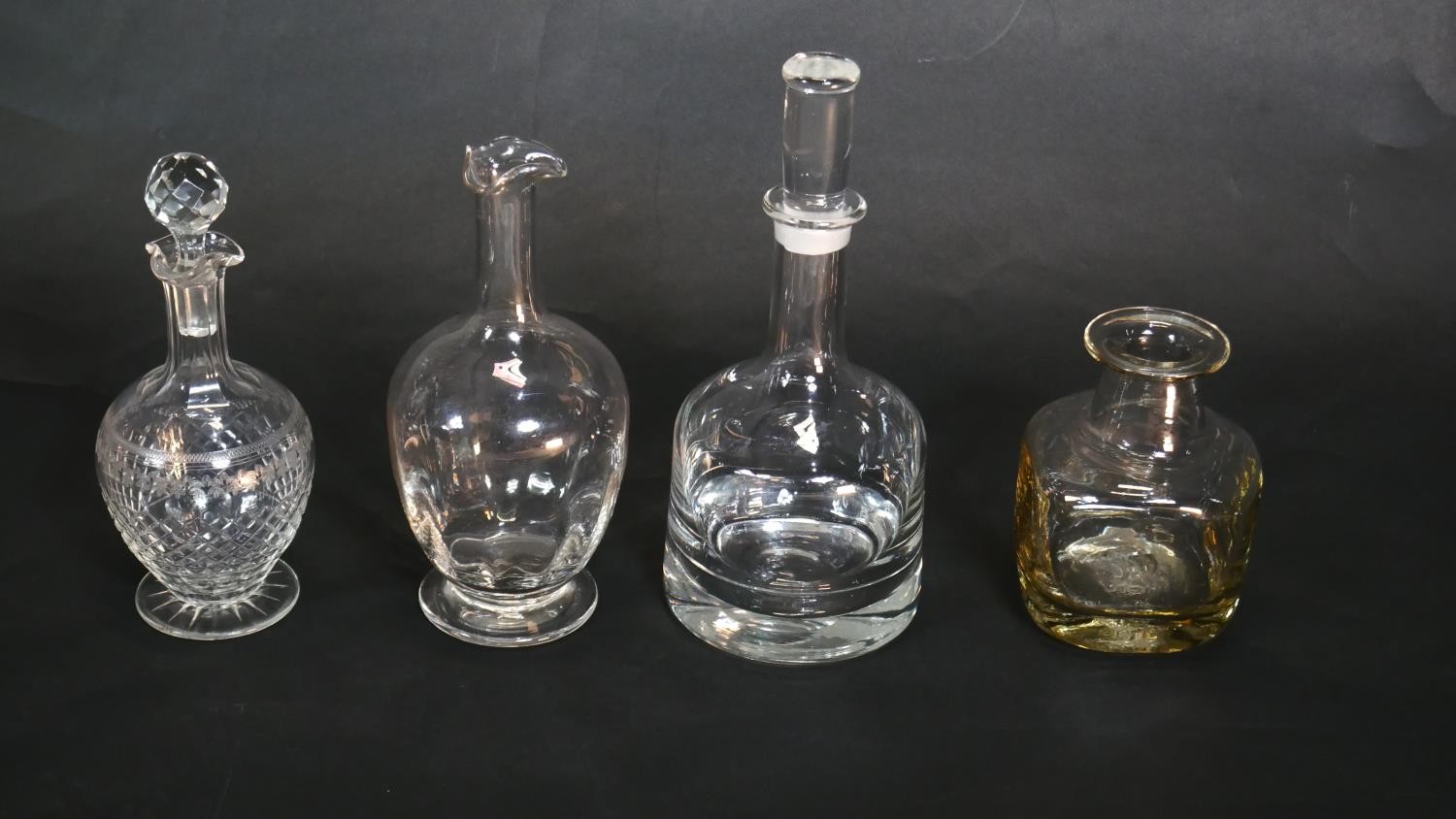 A collection of glassware. Including three crystal decanters including a Frank Thrower, Dartington