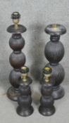 Four carved and stained table lamps with ridged bulbous design. H.60CM
