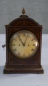 A Victorian mahogany inlaid mantle clock. Brass plaque reads John Walton, 1900. Key does not work.