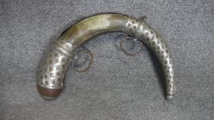 An Islamic copper, brass and white metal gun powder horn, with two hanging loops and white metal