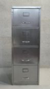 A metal four drawer filing cabinet. H.132 x W.12 x D.62cm