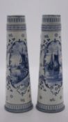 Two antique Royal Bonn Delft hand painted blue and white beer steins, one with a windmill scene