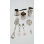 A collection of silver items. Including an Egyptian silver coffee pot, an Egyptian repousse silver