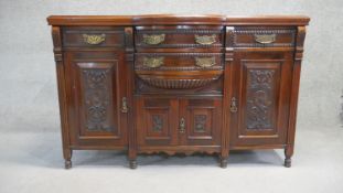 A 19th century carved walnut sideboard. H. 96 W. 150 D. 53